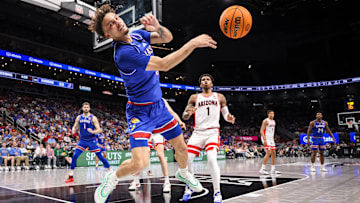 Mar 13, 2025; Kansas City, MO, USA; Kansas Jayhawks guard Zeke Mayo (5) saves an out of bounds ball during the second half against the Arizona Wildcats at T-Mobile Center. Mandatory Credit: William Purnell-Imagn Images