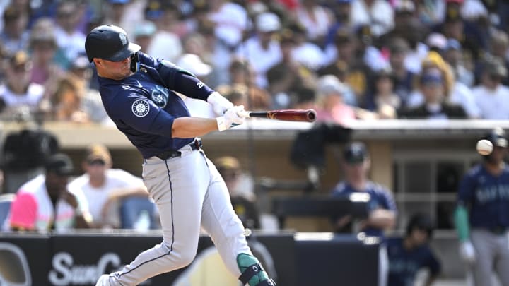 Seattle Mariners first baseman Ty France (23) hits a single against the San Diego Padres during the fourth inning at Petco Park. Mandatory Credit: Orlando Ramirez-USA TODAY Sports