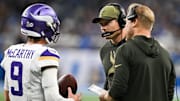 Nov 2, 2025; Detroit, Michigan, USA; Minnesota Vikings head coach Kevin O'Connell speaks with Minnesota Vikings quarterback J.J. McCarthy (9) in the first quarter against the Detroit Lions at Ford Field.