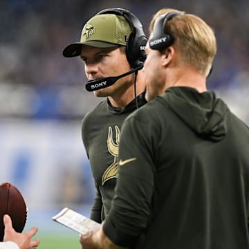 Nov 2, 2025; Detroit, Michigan, USA; Minnesota Vikings head coach Kevin O'Connell speaks with Minnesota Vikings quarterback J.J. McCarthy (9) in the first quarter against the Detroit Lions at Ford Field.