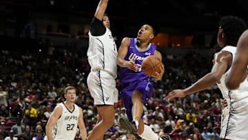 Jul 14, 2025; Las Vegas, NV, USA;  Utah Jazz forward John Tonje (17) drives towards the basket against San Antonio Spurs forward Carter Bryant (11) during the first half of a NBA basketball game at the Thomas & Mack Center. Mandatory Credit: Lucas Peltier-Imagn Images