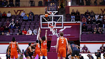 Jan 4, 2025; Blacksburg, Virginia, USA; Virginia Tech Hokies forward Mylyjael Poteat (34) shoots a free throw with 2.7 seconds left to win the game over the Miami Hurricanes at Cassell Coliseum. Mandatory Credit: Peter Casey-Imagn Images