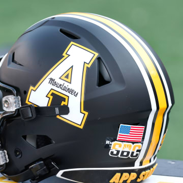 Sep 17, 2022; Boone, North Carolina, USA; An Appalachian State Mountaineers helmet sits on the bench during the second quarter against the Troy Trojans at Kidd Brewer Stadium. Mandatory Credit: Reinhold Matay-USA TODAY Sports