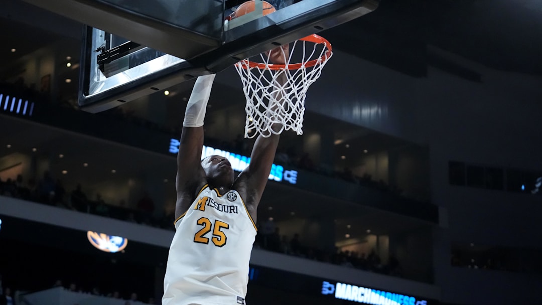 Mar 20, 2025; Wichita, KS, USA; Missouri Tigers guard Mark Mitchell (25) dunks in the second half of a first round men’s NCAA Tournament game Drake Bulldogs at Intrust Bank Arena. Mandatory Credit: Kirby Lee-Imagn Images