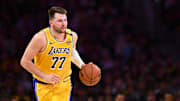 Apr 11, 2025; Los Angeles, California, USA; Los Angeles Lakers guard Luka Doncic (77) moves the ball against the Houston Rockets during the first half at Crypto.com Arena. Mandatory Credit: Jonathan Hui-Imagn Images