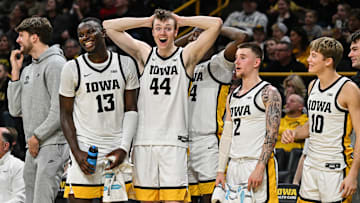 Dec 30, 2024; Iowa City, Iowa, USA; Iowa Hawkeyes forward Riley Mulvey (44) and Iowa Hawkeyes forward Ladji Dembele (13) and Iowa Hawkeyes guard Brock Harding (2) and Iowa Hawkeyes guard Jacob Koch (10) and the Hawkeyes bench react during the second half against the New Hampshire Wildcats at Carver-Hawkeye Arena. Mandatory Credit: Jeffrey Becker-Imagn Images
