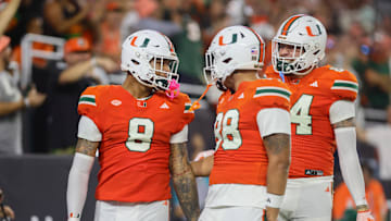 Sep 27, 2024; Miami Gardens, Florida, USA; Miami Hurricanes tight end Elijah Arroyo (8) celebrates with tight end Riley Williams (88) after scoring a touchdown against the Virginia Tech Hokies during the first quarter at Hard Rock Stadium. Mandatory Credit: Sam Navarro-Imagn Images