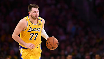 Apr 11, 2025; Los Angeles, California, USA; Los Angeles Lakers guard Luka Doncic (77) moves the ball against the Houston Rockets during the first half at Crypto.com Arena. Mandatory Credit: Jonathan Hui-Imagn Images