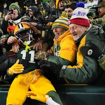 Green Bay Packers receiver Jayden Reed (11) celebrates after scoring a touchdown against the Miami Dolphins at Lambeau Field.