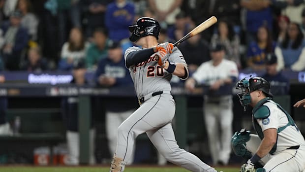 Detroit Tigers player Spencer Torkelson swings the bat wearing a gray jersey and blue helme