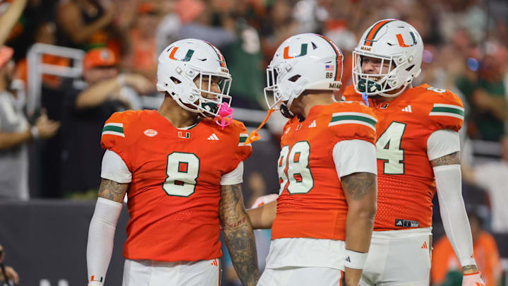 Sep 27, 2024; Miami Gardens, Florida, USA; Miami Hurricanes tight end Elijah Arroyo (8) celebrates with tight end Riley Williams (88) after scoring a touchdown against the Virginia Tech Hokies during the first quarter at Hard Rock Stadium. Mandatory Credit: Sam Navarro-Imagn Images