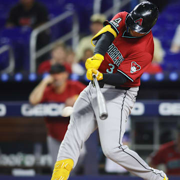 Aug 20, 2024; Miami, Florida, USA; Arizona Diamondbacks designated hitter Joc Pederson (3) hits an RBI single against the Miami Marlins during the first inning at loanDepot Park.