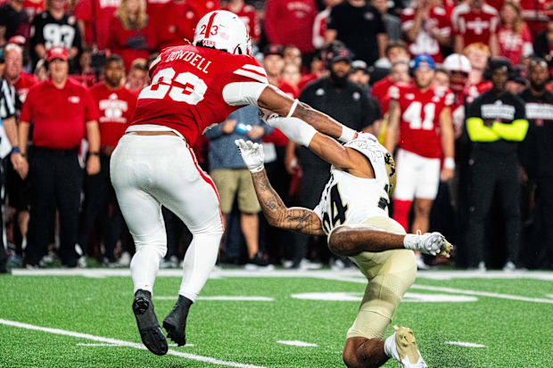 Nebraska Cornhuskers running back Dante Dowdell (23) stiff arms