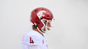 Sep 14, 2024; Seattle, Washington, USA; Washington State Cougars quarterback Zevi Eckhaus (4) walks through smoke before the game against the Washington Huskies at Lumen Field. Mandatory Credit: Steven Bisig-Imagn Images