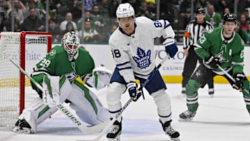 Dec 18, 2024; Dallas, Texas, USA; Dallas Stars goaltender Jake Oettinger (29) and Toronto Maple Leafs right wing William Nylander (88) look for the puck in the Dallas zone during the first period at the American Airlines Center. Mandatory Credit: Jerome Miron-Imagn Images