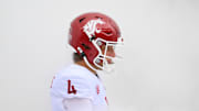Sep 14, 2024; Seattle, Washington, USA; Washington State Cougars quarterback Zevi Eckhaus (4) walks through smoke before the game against the Washington Huskies at Lumen Field. Mandatory Credit: Steven Bisig-Imagn Images
