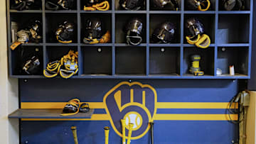 Apr 5, 2025; Milwaukee, Wisconsin, USA;  General view of Milwaukee Brewers batting helmets in the dugout prior to the game against the Cincinnati Reds at American Family Field. Mandatory Credit: Jeff Hanisch-Imagn Images