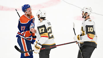 May 14, 2023; Edmonton, Alberta, CAN; Edmonton Oilers center Connor McDavid (97) shakes hands with Vegas Golden Knights defenseman Shea Theodore (27) at the end of the third period in game six of the second round of the 2023 Stanley Cup Playoffs at Rogers Place. Mandatory Credit: Walter Tychnowicz-Imagn Images