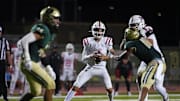 Millard South Jett Thomalla (4) looks for receivers against Basha during a game at Basha High School in Chandler on Aug. 30, 2024.