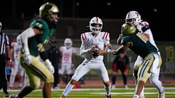 Millard South Jett Thomalla (4) looks for receivers against Basha during a game at Basha High School in Chandler, Arizona, on Friday, Aug. 30, 2024.