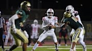 Millard South Jett Thomalla (4) looks for receivers against Basha during a game at Basha High School in Chandler on Aug. 30, 2024.