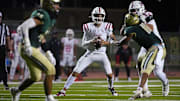 Millard South Jett Thomalla (4) looks for receivers against Basha during a game at Basha High School in Chandler on Aug. 30, 2024.