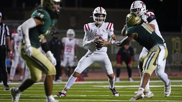 Millard South Jett Thomalla (4) looks for receivers against Basha during a game at Basha High School in Chandler on Aug. 30, 2024. Millard South Jett Thomalla (4) looks for receivers against Basha during a game at Basha High School in Chandler on Aug. 30, 2024.