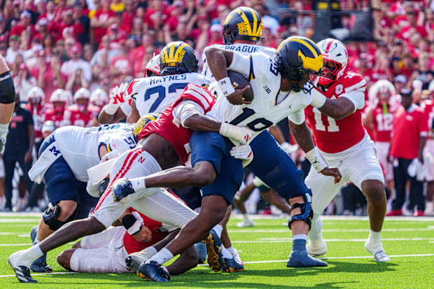 Michigan Wolverines quarterback Bryce Underwood gets sacked by Nebraska Cornhuskers linebacker Dasan McCullough during the se