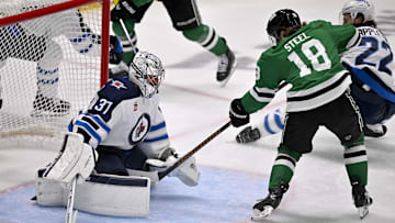 May 17, 2025; Dallas, Texas, USA; Winnipeg Jets goaltender Connor Hellebuyck (37) stops a shot by Dallas Stars center Sam Steel (18) during the first period in game six of the second round of the 2025 Stanley Cup Playoffs at American Airlines Center. Mandatory Credit: Jerome Miron-Imagn Images