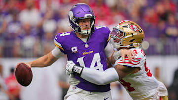 Sep 15, 2024; Minneapolis, Minnesota, USA; San Francisco 49ers defensive end Yetur Gross-Matos (94) tackles Minnesota Vikings quarterback Sam Darnold (14) in the third quarter at U.S. Bank Stadium. Mandatory Credit: Brad Rempel-Imagn Images