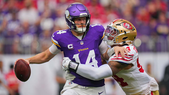 Sep 15, 2024; Minneapolis, Minnesota, USA; San Francisco 49ers defensive end Yetur Gross-Matos (94) tackles Minnesota Vikings quarterback Sam Darnold (14) in the third quarter at U.S. Bank Stadium.