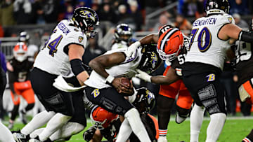 Nov 16, 2025; Cleveland, Ohio, USA; Baltimore Ravens quarterback Lamar Jackson (8) is sacked by Cleveland Browns defensive tackle Mike Hall Jr. (51) during the fourth quarter at Huntington Bank Field. Mandatory Credit: Ken Blaze-Imagn Images