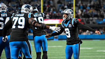 Dec 1, 2024; Charlotte, North Carolina, USA; Carolina Panthers quarterback Bryce Young (9) celebrates with offensive tackle Ikem Ekwonu (79) after the panthers score with 30 seconds left to take the lead in the fourth quarter at Bank of America Stadium. Mandatory Credit: Bob Donnan-Imagn Images