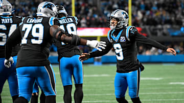 Dec 1, 2024; Charlotte, North Carolina, USA; Carolina Panthers quarterback Bryce Young (9) celebrates with offensive tackle Ikem Ekwonu (79) after the panthers score with 30 seconds left to take the lead in the fourth quarter at Bank of America Stadium. Mandatory Credit: Bob Donnan-Imagn Images