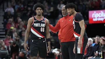 Jan 14, 2025; Portland, Oregon, USA: Portland Trail Blazers head coach Chauncey Billups talks to Scoot Henderson (00) and Shaedon Sharpe (17) during the first half against the Brooklyn Nets at Moda Center. Mandatory Credit: Soobum Im-Imagn Images
