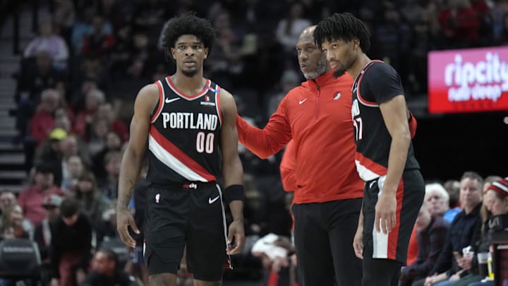 Jan 14, 2025; Portland, Oregon, USA: Portland Trail Blazers head coach Chauncey Billups talks to Scoot Henderson (00) and Shaedon Sharpe (17) during the first half against the Brooklyn Nets at Moda Center. Mandatory Credit: Soobum Im-Imagn Images