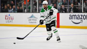 Mar 31, 2025; Seattle, Washington, USA; Dallas Stars defenseman Mathew Dumba (3) passes the puck against the Seattle Kraken during the third period at Climate Pledge Arena. Mandatory Credit: Steven Bisig-Imagn Images