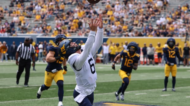 West Virginia University senior quarterback Garrett Greene attempts to bring in a pass during the 2024 Gold-Blue Spring Game.