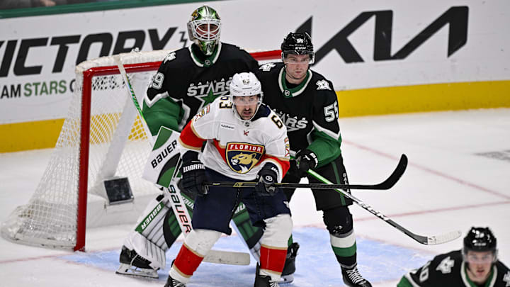 Dec 13, 2025; Dallas, Texas, USA; Florida Panthers left wing Brad Marchand (63) skates in front of Dallas Stars defenseman Thomas Harley (55) and goaltender Jake Oettinger (29) during the game at the American Airlines Center. Mandatory Credit: Jerome Miron-Imagn Images