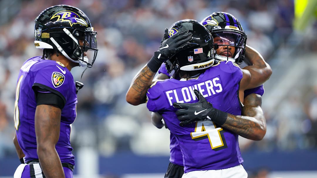 Sep 22, 2024; Arlington, Texas, USA;  Baltimore Ravens wide receiver Rashod Bateman (7) celebrates with Baltimore Ravens wide receiver Zay Flowers (4) and Baltimore Ravens quarterback Lamar Jackson.