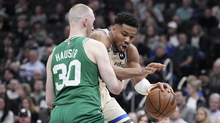 Mar 2, 2026; Milwaukee, Wisconsin, USA; Milwaukee Bucks forward Giannis Antetokounmpo (34) drives against Boston Celtics forward Sam Hauser (30) in the first half at Fiserv Forum. Mandatory Credit: Michael McLoone-Imagn Images