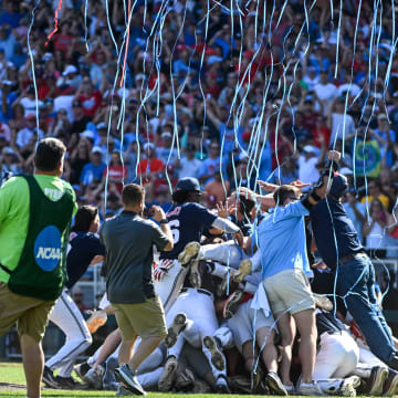 Jun 26, 2022; Omaha, NE, USA;  The Ole Miss Rebels celebrate winning the National Championship and the College World Series against the Oklahoma Sooners at Charles Schwab Field. Mandatory Credit: Steven Branscombe-USA TODAY Sports