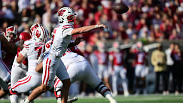 Nov 15, 2025; Bloomington, Indiana, USA; Wisconsin Badgers quarterback Carter Smith (5) passes the ball during the second half against the Indiana Hoosiers at Memorial Stadium. Mandatory Credit: Marc Lebryk-Imagn Images