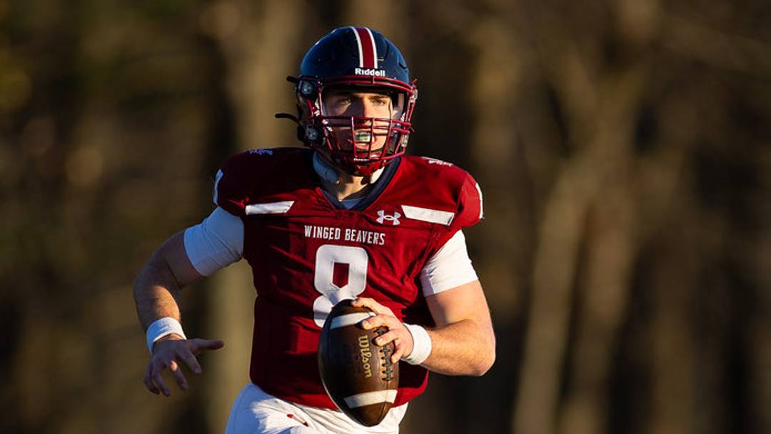 Avon Old Farms' quarterback Matthew Baer looks up field for a receiver. Avon Old Farms' quarterback Matthew Baer looks up field for a receiver.