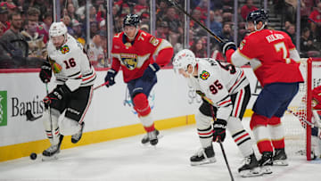 Feb 1, 2025; Sunrise, Florida, USA;  Chicago Blackhawks center Jason Dickinson (16) looks to keep the puck in the Florida Panthers zone in the first period at Amerant Bank Arena. Mandatory Credit: Jim Rassol-Imagn Images