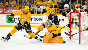 Oct 22, 2024; Nashville, Tennessee, USA;  Nashville Predators goaltender Juuse Saros (74) blocks a shot against the Boston Bruins during the second period at Bridgestone Arena. Mandatory Credit: Steve Roberts-Imagn Images