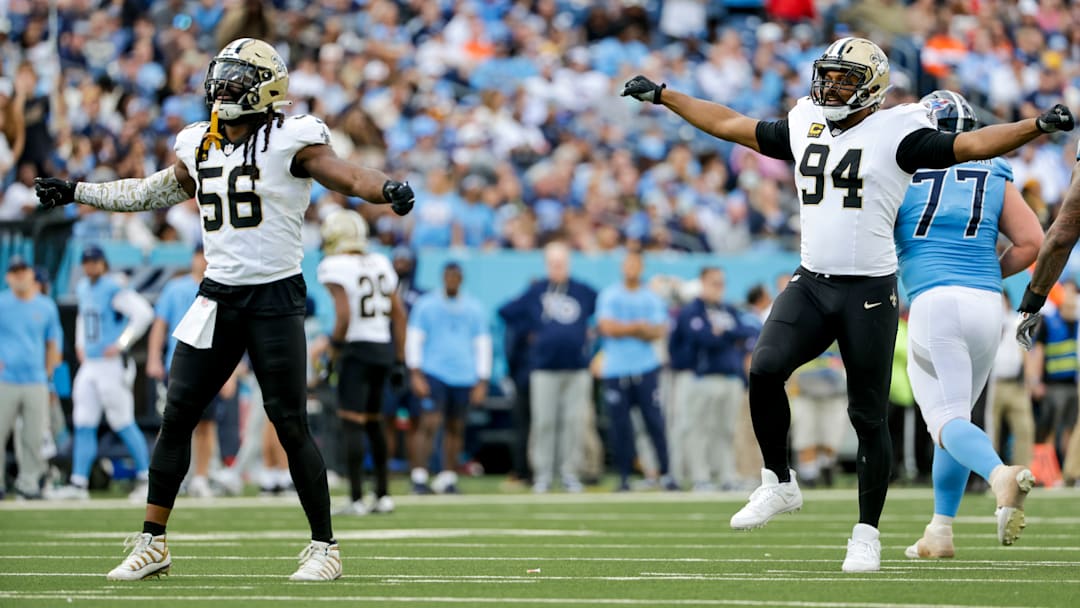 New Orleans Saints LB Demario Davis (56) celebrates with DE Cam Jordan (94) after sacking Tennessee Titans QB Cam Ward on Dec. 28, 2025