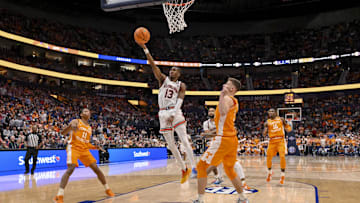 Mar 15, 2025; Nashville, TN, USA;  Auburn Tigers guard Miles Kelly (13) lays the ball in against the Tennessee Volunteers during the second half at Bridgestone Arena. Mandatory Credit: Steve Roberts-Imagn Images