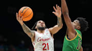 Nov 26, 2025; Las Vegas, NV, USA; Houston Cougars guard Emanuel Sharp (21) is defended by Notre Dame Fighting Irish guard Jalen Haralson (10) in the 2025 Players Era Festival at MGM Grand Garden Arena. Mandatory Credit: Kirby Lee-Imagn Images