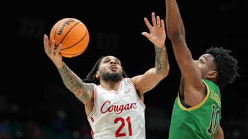 Nov 26, 2025; Las Vegas, NV, USA; Houston Cougars guard Emanuel Sharp (21) is defended by Notre Dame Fighting Irish guard Jalen Haralson (10) in the 2025 Players Era Festival at MGM Grand Garden Arena. Mandatory Credit: Kirby Lee-Imagn Images